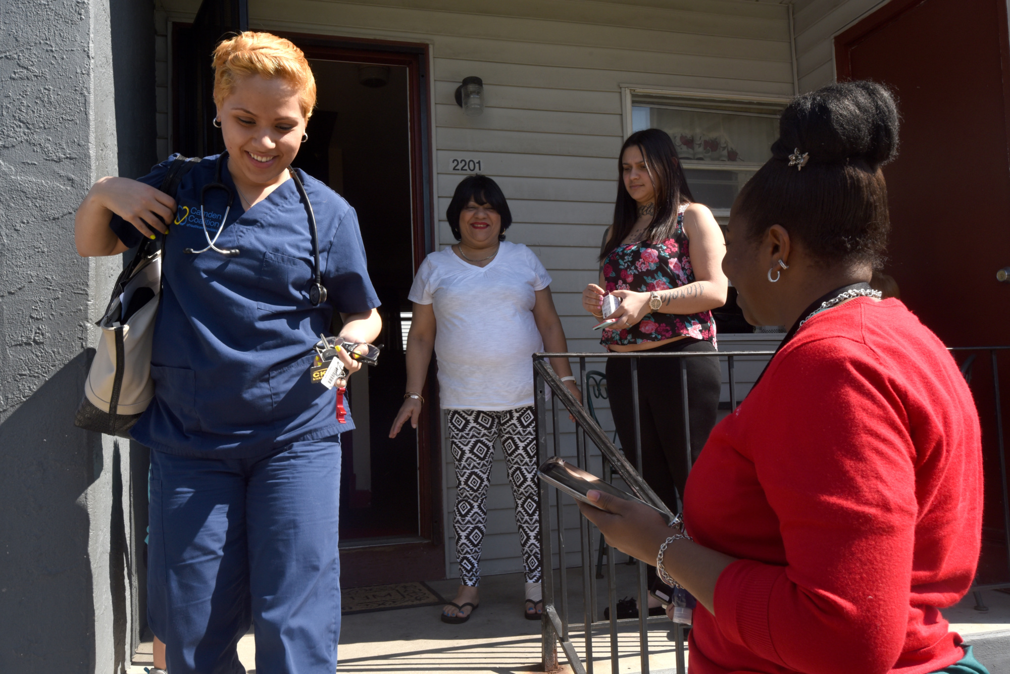 Care team leaving participant's house after a home visit